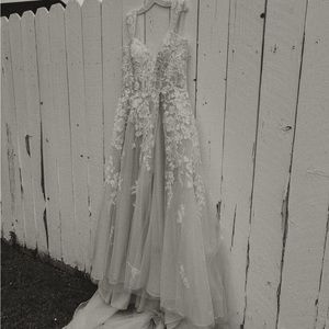 A Line Style 
Ivory. Tulle, Flower Embellishments, Glitter, Removable Straps,